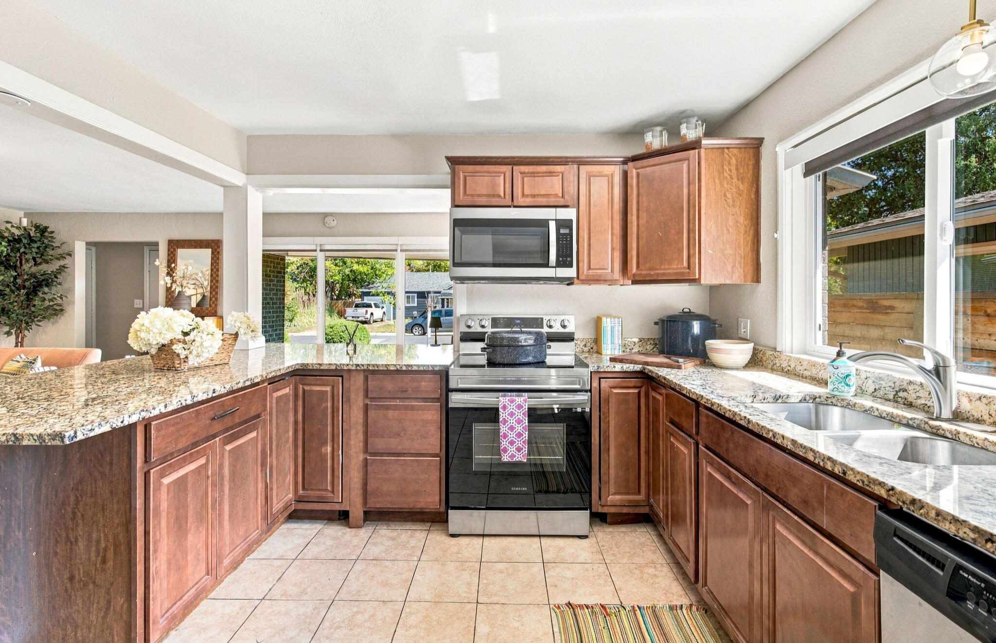 Fully equipped kitchen with full-size appliances in furnished Denver home